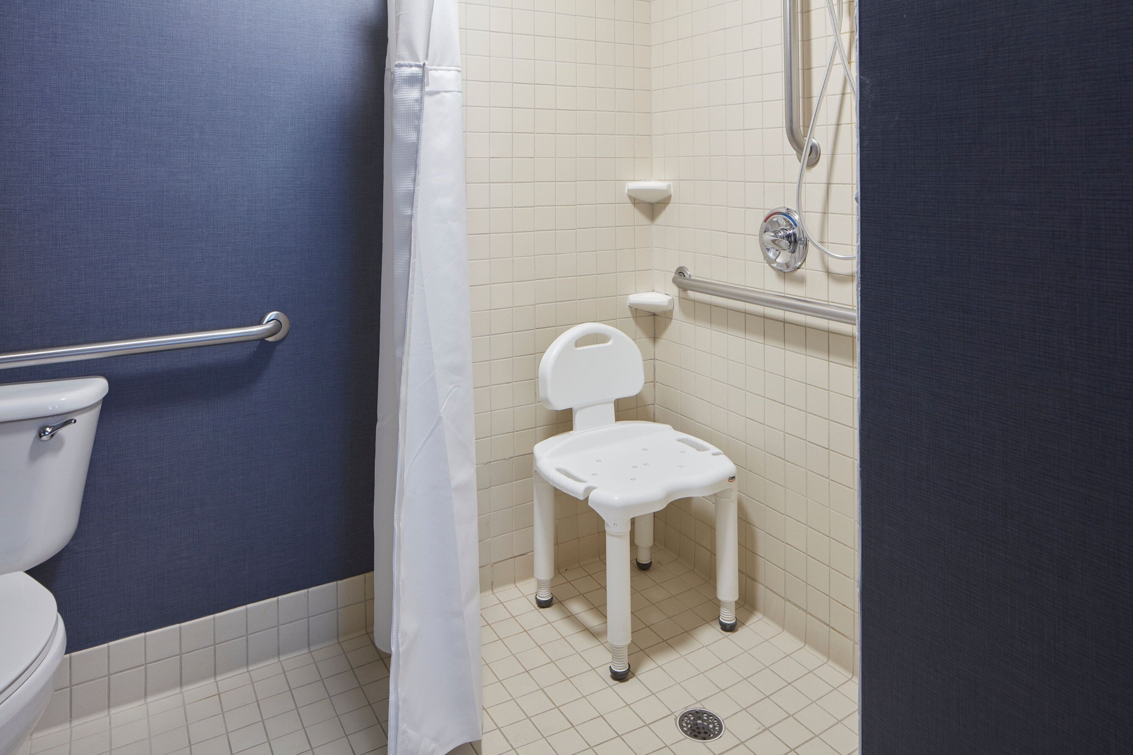 suite, 2 bedrooms, non smoking (mobility/hearing access, roll-in shwr) | bathroom | combined shower/bathtub, designer toiletries, hair dryer, towels