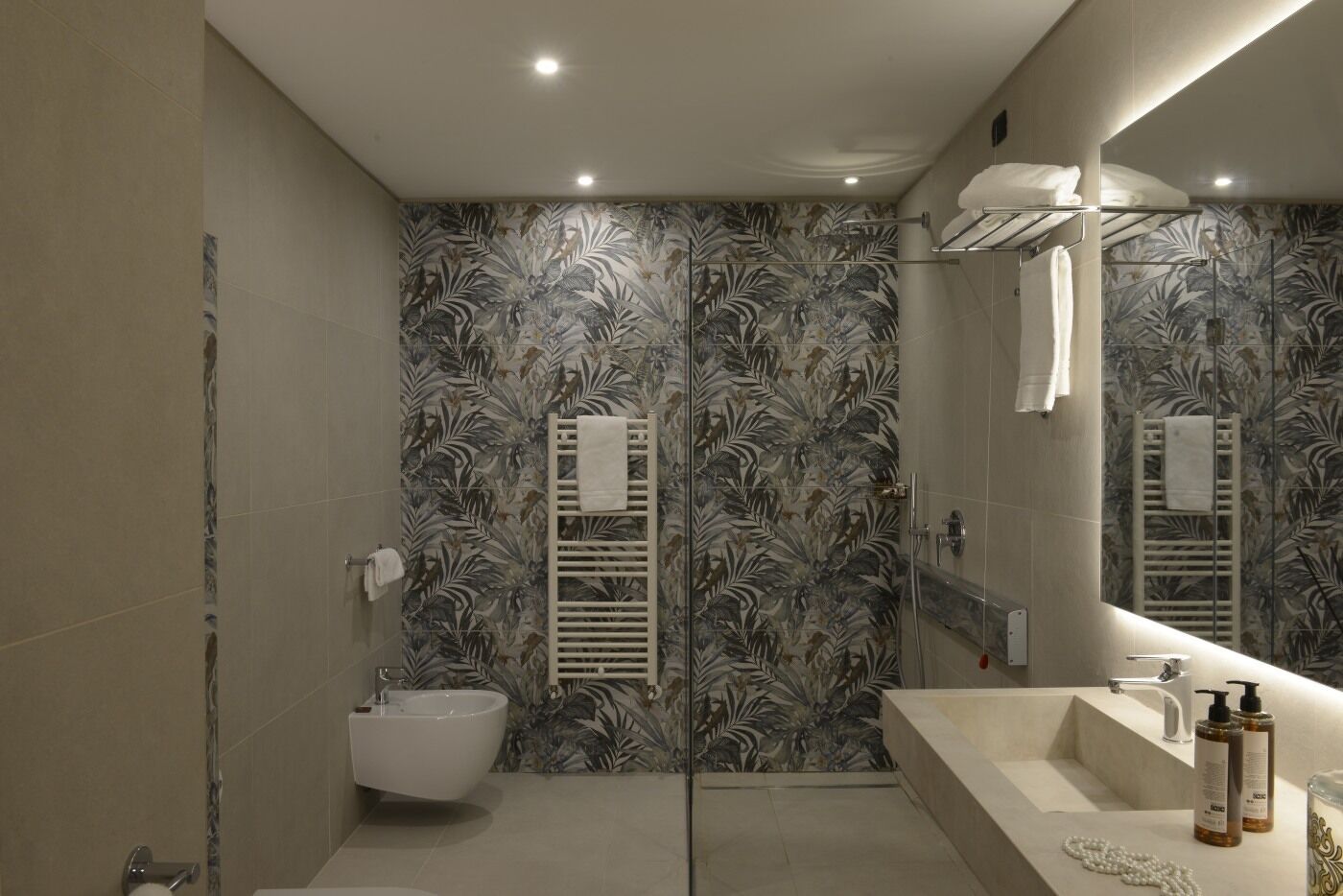 junior suite | bathroom | shower, rainfall showerhead, hair dryer, bidet