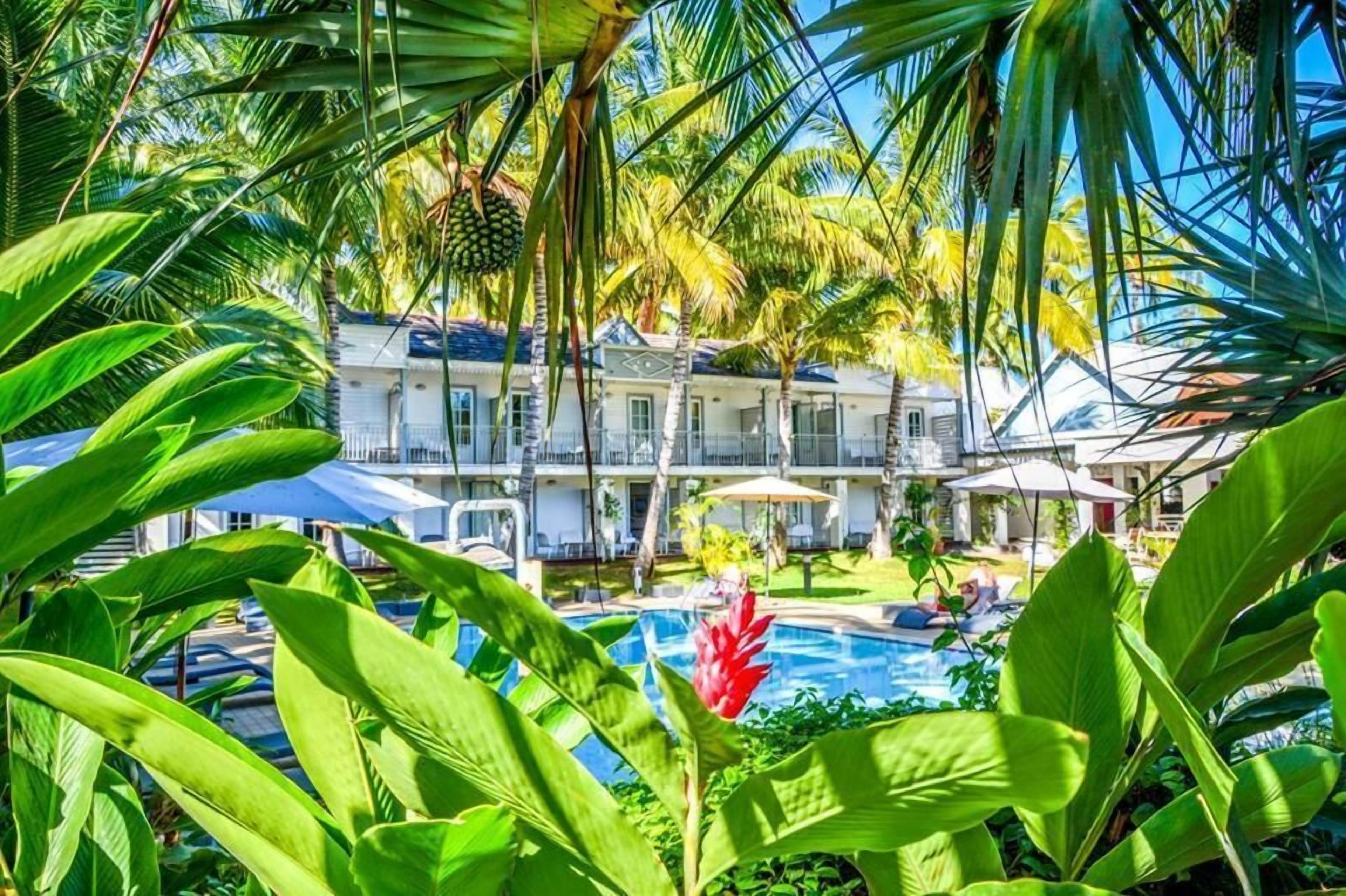 Outdoor pool, open 9:00 AM to 10 PM, pool umbrellas, pool loungers