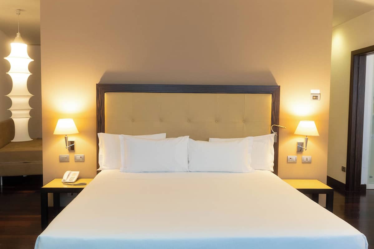 Family Room | Down comforters, minibar, in-room safe, individually furnished