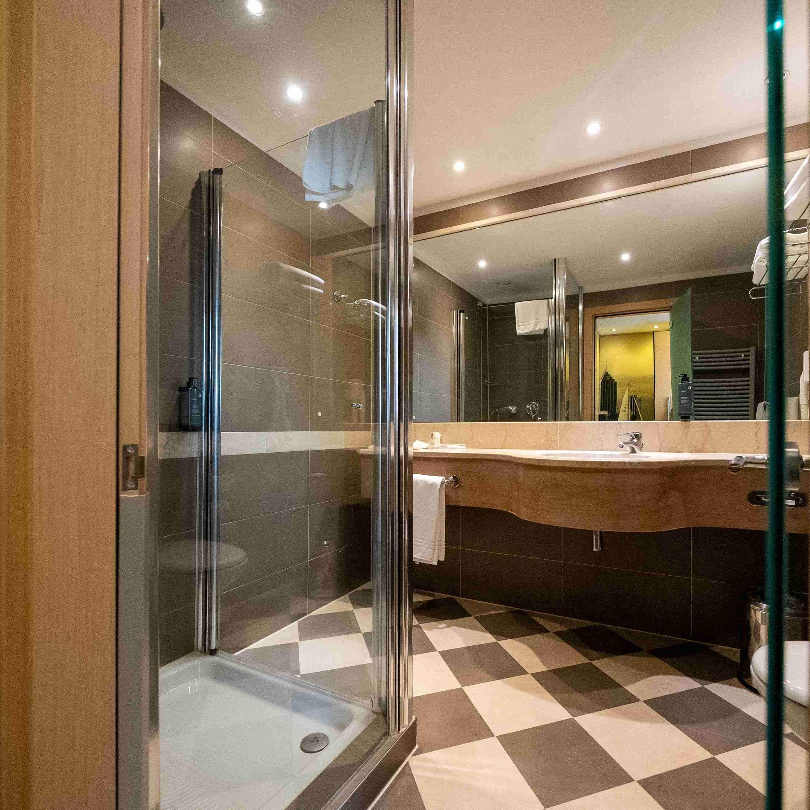 superior room | bathroom | shower, free toiletries, hair dryer, slippers
