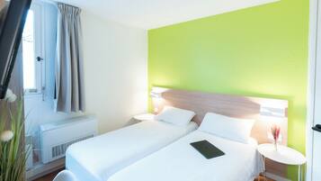 Twin Room | Desk, blackout drapes, iron/ironing board, free cribs/infant beds