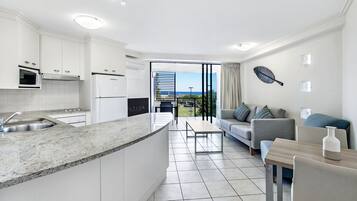 Apartment, 1 Bedroom | Living area | 32-inch LED TV with digital channels, TV, DVD player