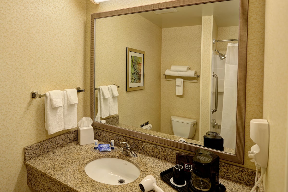 premium bedding, desk, blackout curtains, iron/ironing board