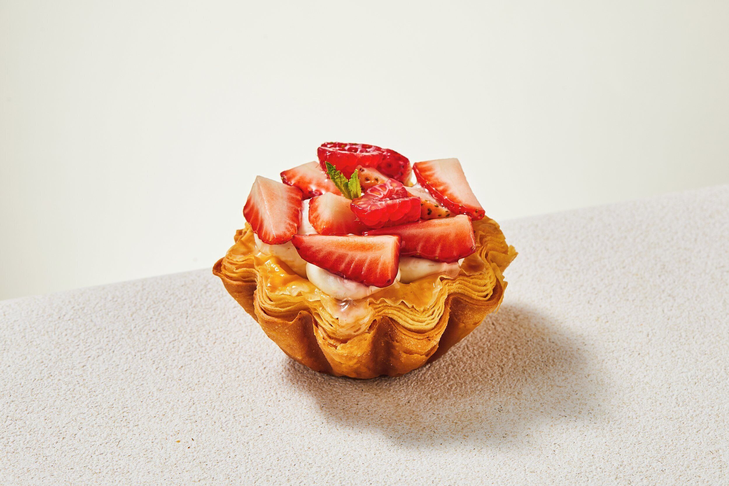 A dessert with strawberries and cream.