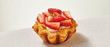 A dessert with strawberries and cream.