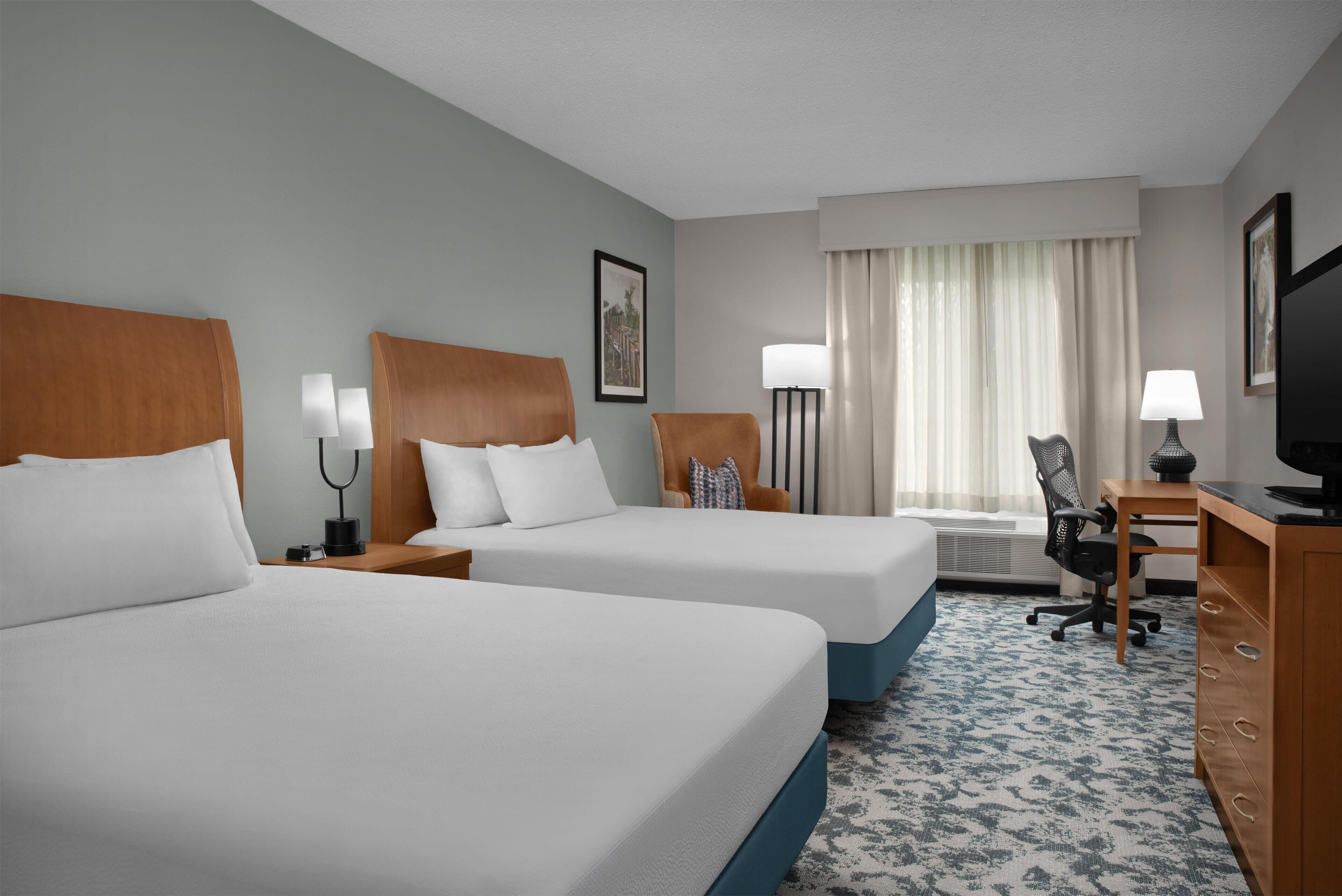 Two Queens | In-room safe, desk, iron/ironing board, free cribs/infant beds