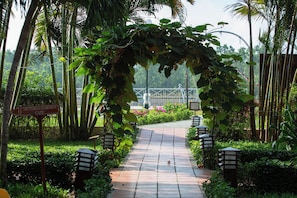 Stroll through the lush garden, lined with bamboo and flowering shrubs, and follow the pathway to the Victoria Garden Cafe.