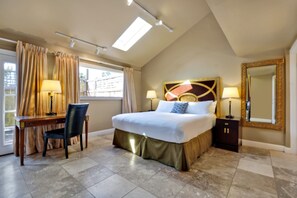 Relax in comfort with a large bed, desk, and ample workspace.