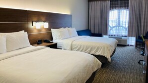 A hotel room with two beds, a desk, a chair, and a window with curtains. - Holiday Inn Express & Suites Abilene by IHG (Abilene)