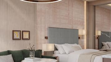 Una habitación de hotel moderna con una cama grande, un sofá verde, una mesa de centro redonda y un espejo amplio.