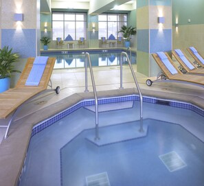 Indoor pool, open 6 AM to 11:00 PM, pool loungers