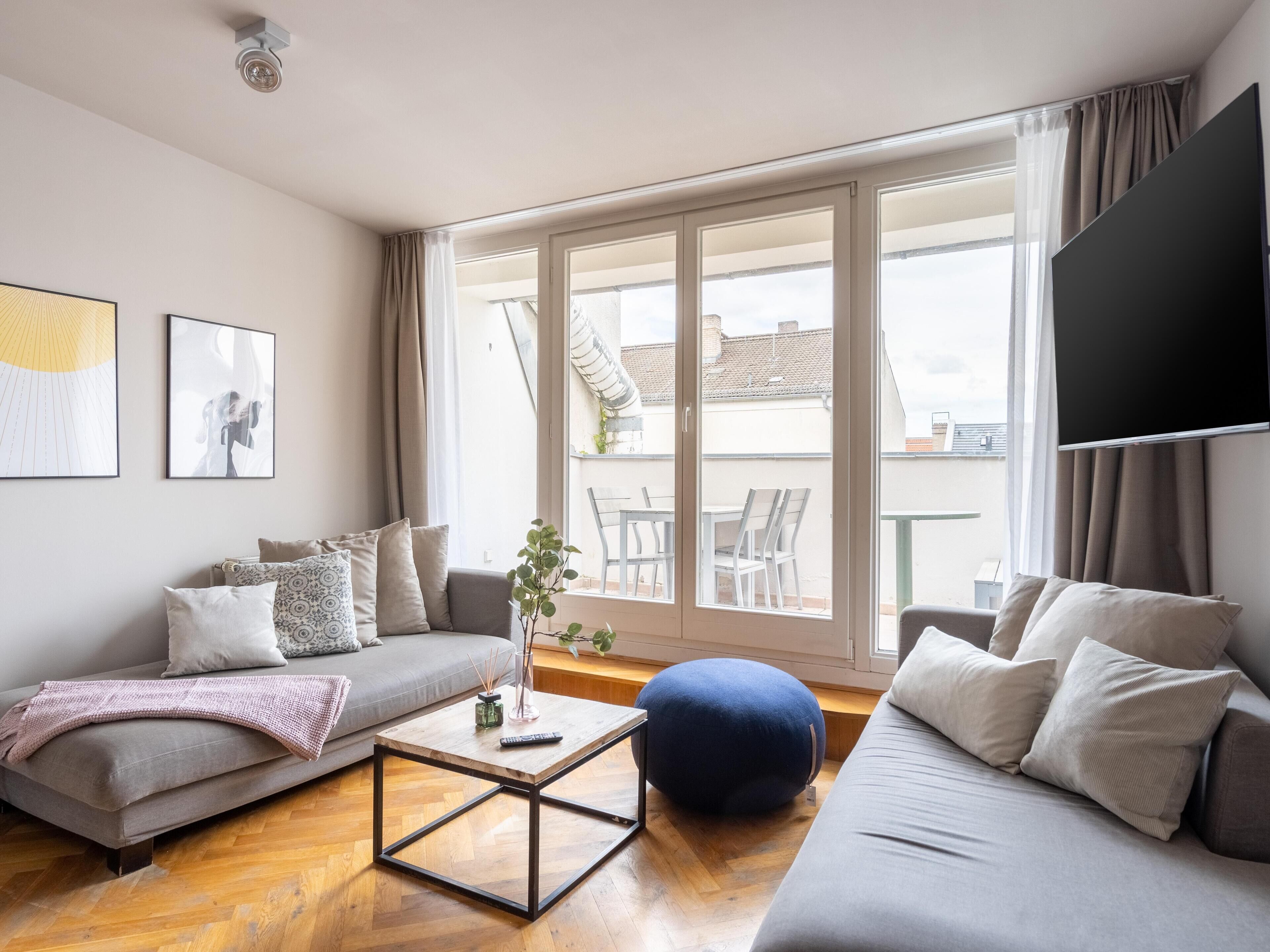 Two-Bedroom Suite with Balcony | Living area | 50-inch flat-screen TV with cable channels, TV