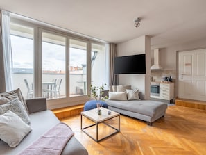 Two-Bedroom Suite with Balcony | Living area | 50-inch flat-screen TV with cable channels, TV - Schoenhouse Avenue by Limehome (Berlin)