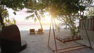 Beachfront Sunset Villa with Transfer Included | Living area | 48-inch TV with cable channels