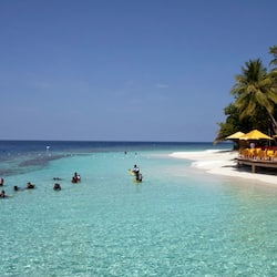 On the beach, white sand, free beach cabanas, sun-loungers