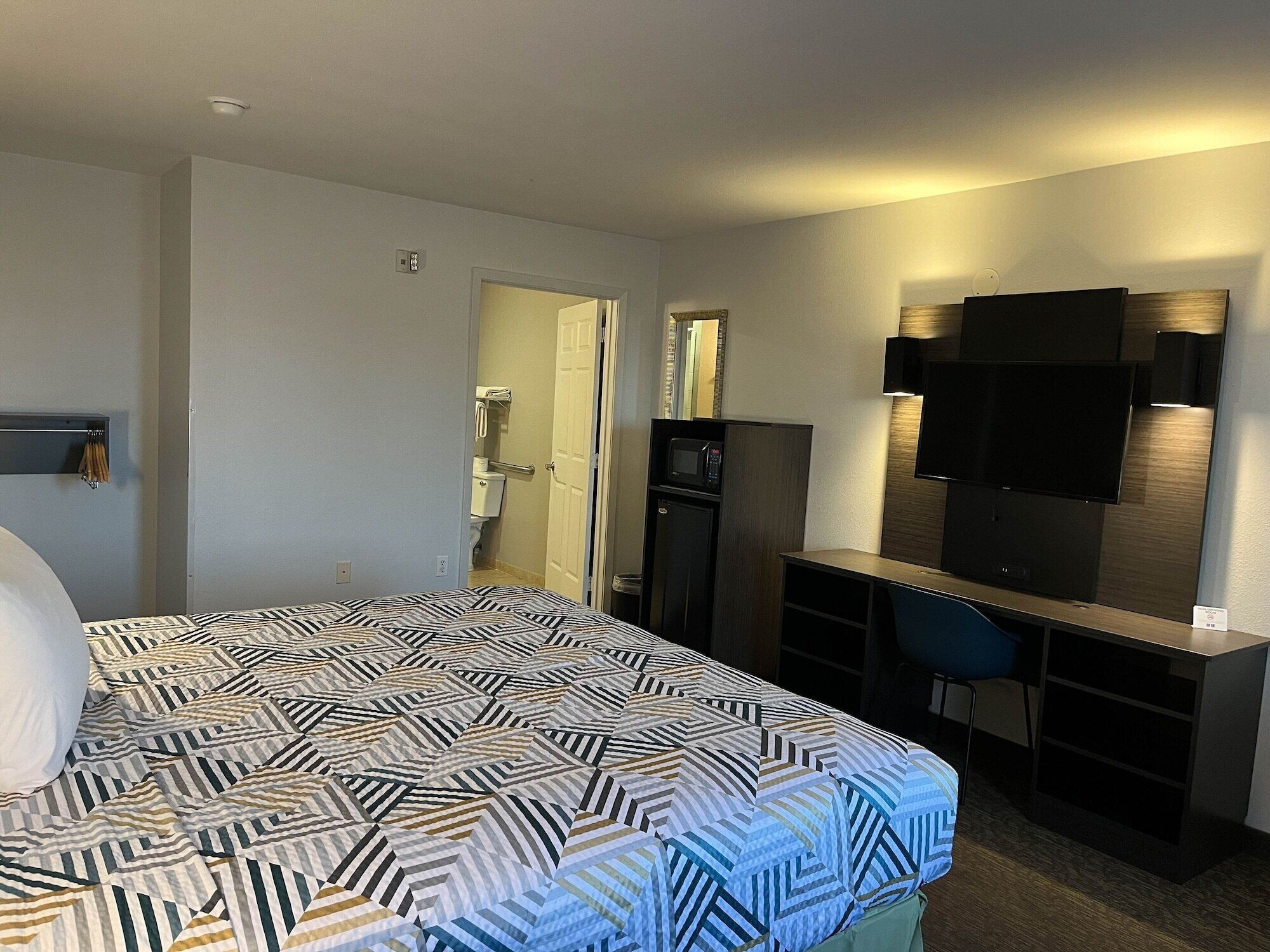 Desk, laptop workspace, blackout drapes, soundproofing