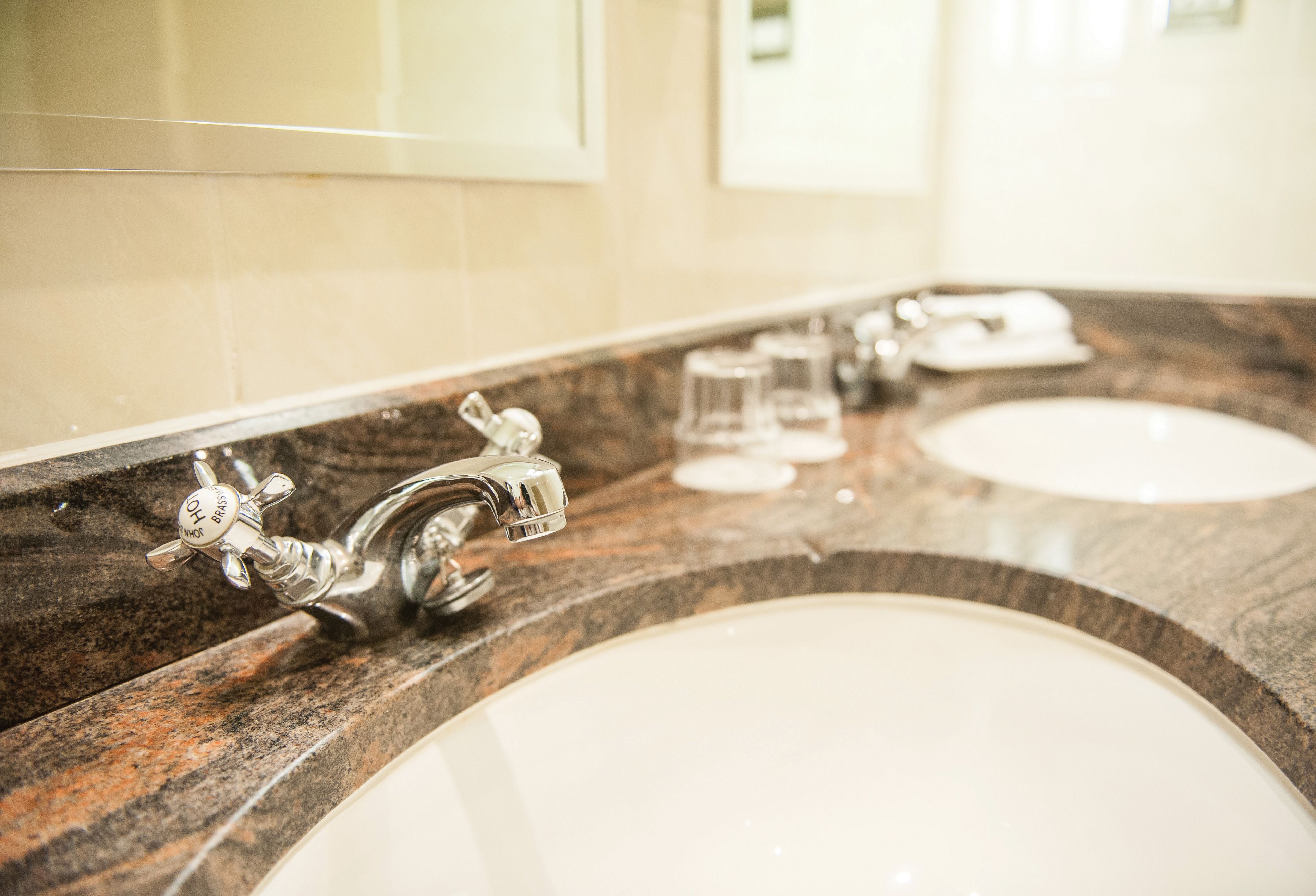 junior suite | bathroom | combined shower/bathtub, designer toiletries, hair dryer, bathrobes