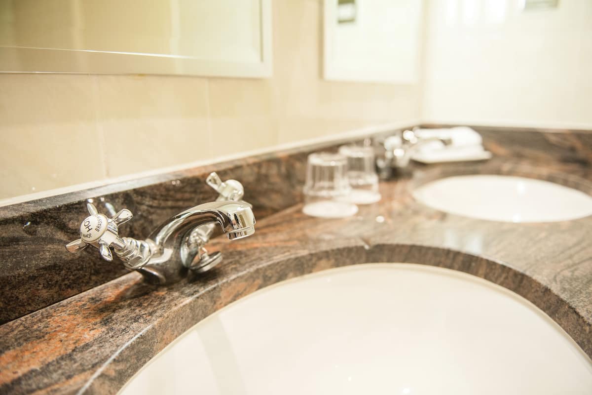 junior suite | bathroom | combined shower/bathtub, designer toiletries, hair dryer, bathrobes