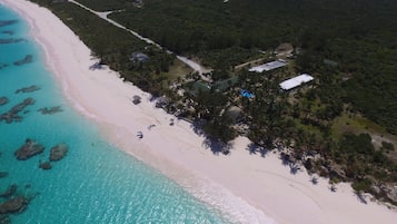 On the beach, white sand, sun loungers, beach towels