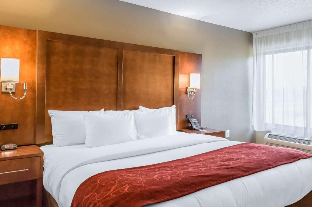 Desk, laptop workspace, blackout drapes, iron/ironing board