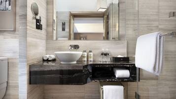 Eco-friendly toiletries, hair dryer, slippers, towels