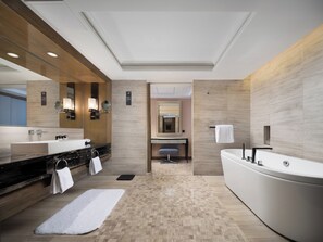 A modern bathroom with a large bathtub, two sinks, and a vanity. - Pullman Shanghai Jing An (Shanghai)