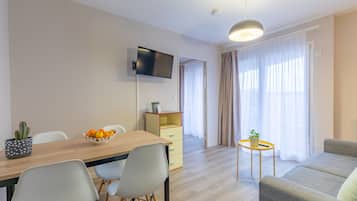 Superior Apartment, 1 Bedroom | Living area | 54-cm flat-screen TV with digital channels, TV
