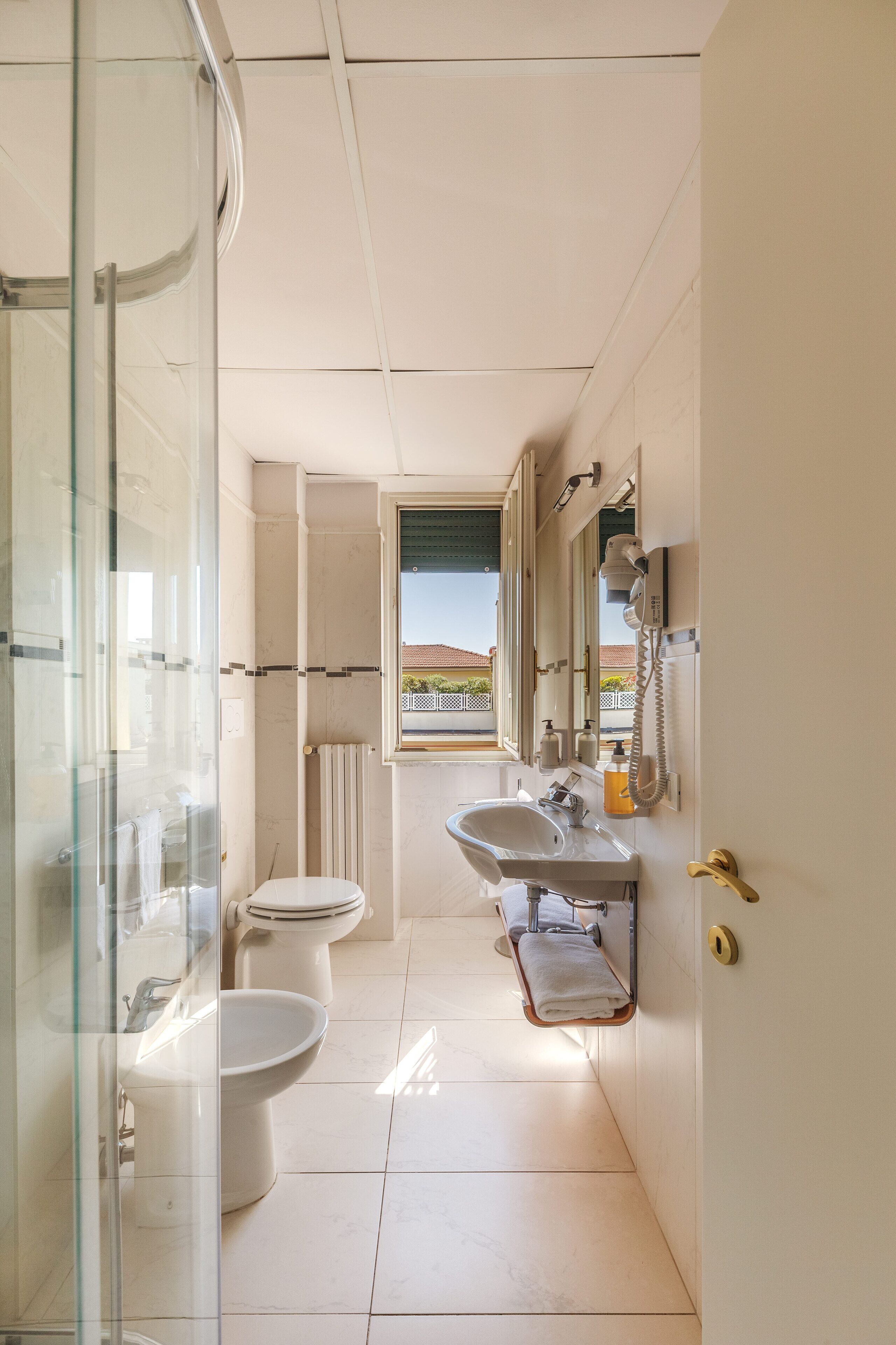 apartment with balcony | bathroom | designer toiletries, hair dryer, slippers, bidet