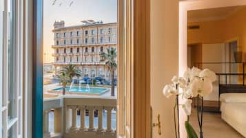 Suite with Balcony and Turkish Bath | Living area | 28-inch LCD TV with satellite channels, TV, first-run films