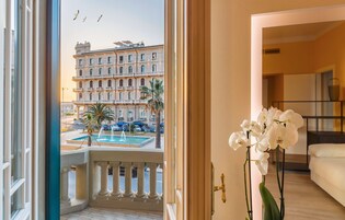 Suite with Balcony and Turkish Bath | Living area | 28-inch LCD TV with satellite channels, TV, first-run movies