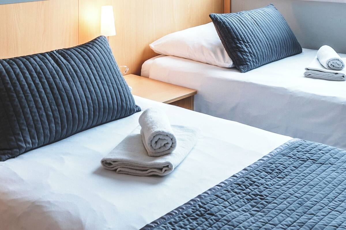 Superior Apartment, 1 Bedroom (Twin) | Desk, laptop workspace, blackout curtains, iron/ironing board