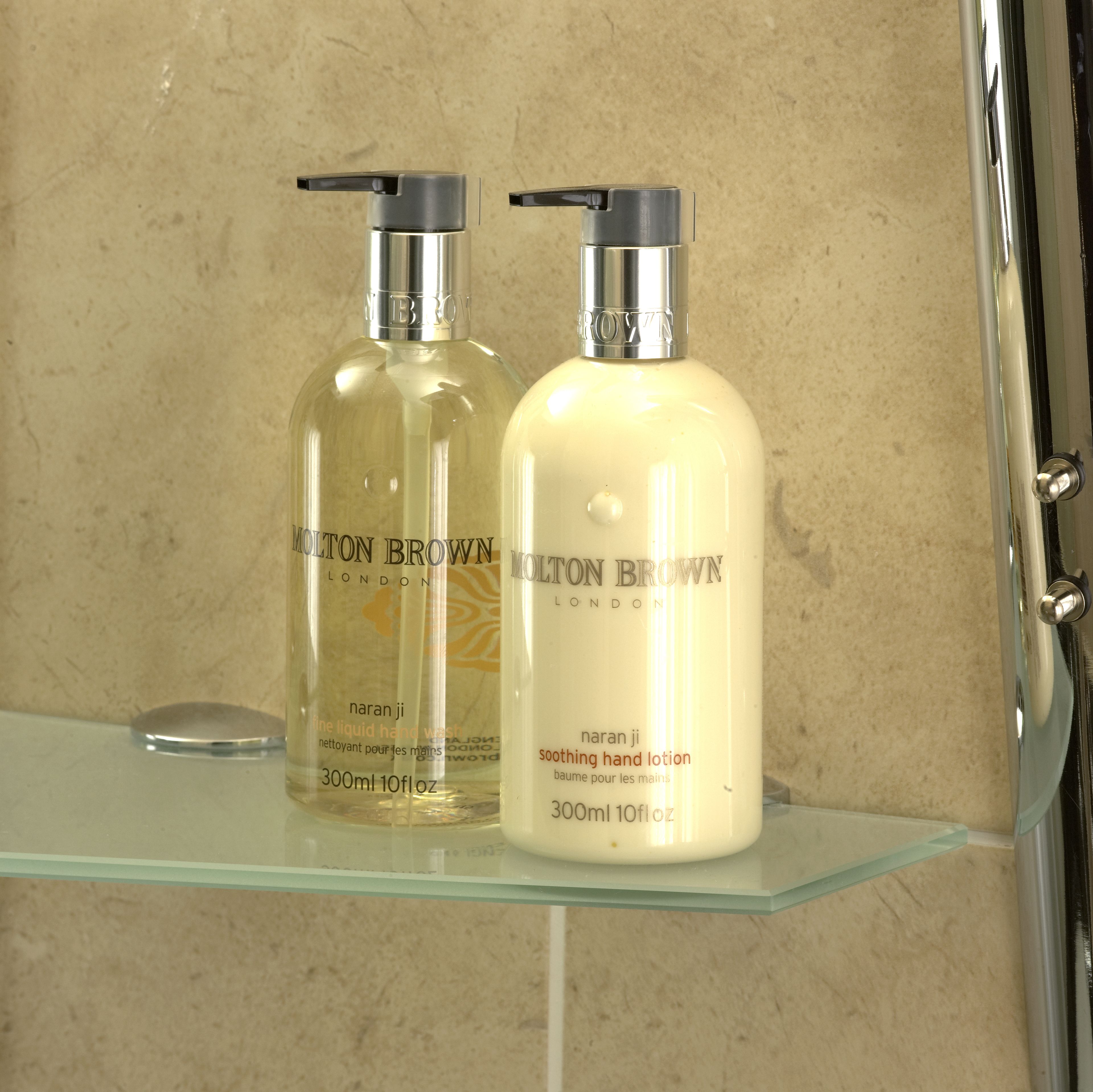 designer toiletries, hair dryer, towels, soap