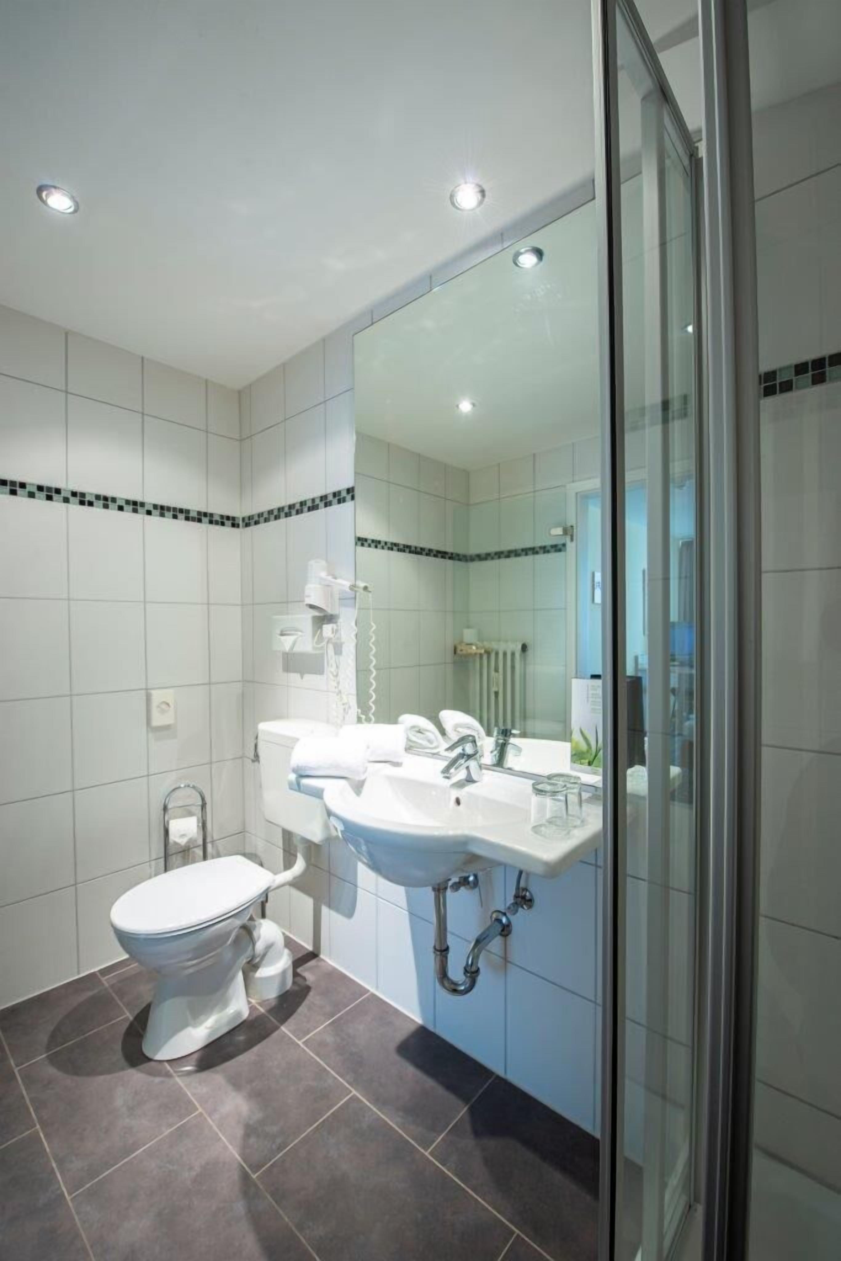 classic double room | bathroom | hair dryer, towels, soap, shampoo