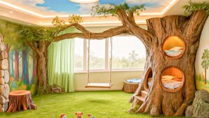 A children's playroom with a tree-themed design, including a swing, treehouse beds, and a soft play area. - Orient Haitian Guibin Hotel (Yantai)