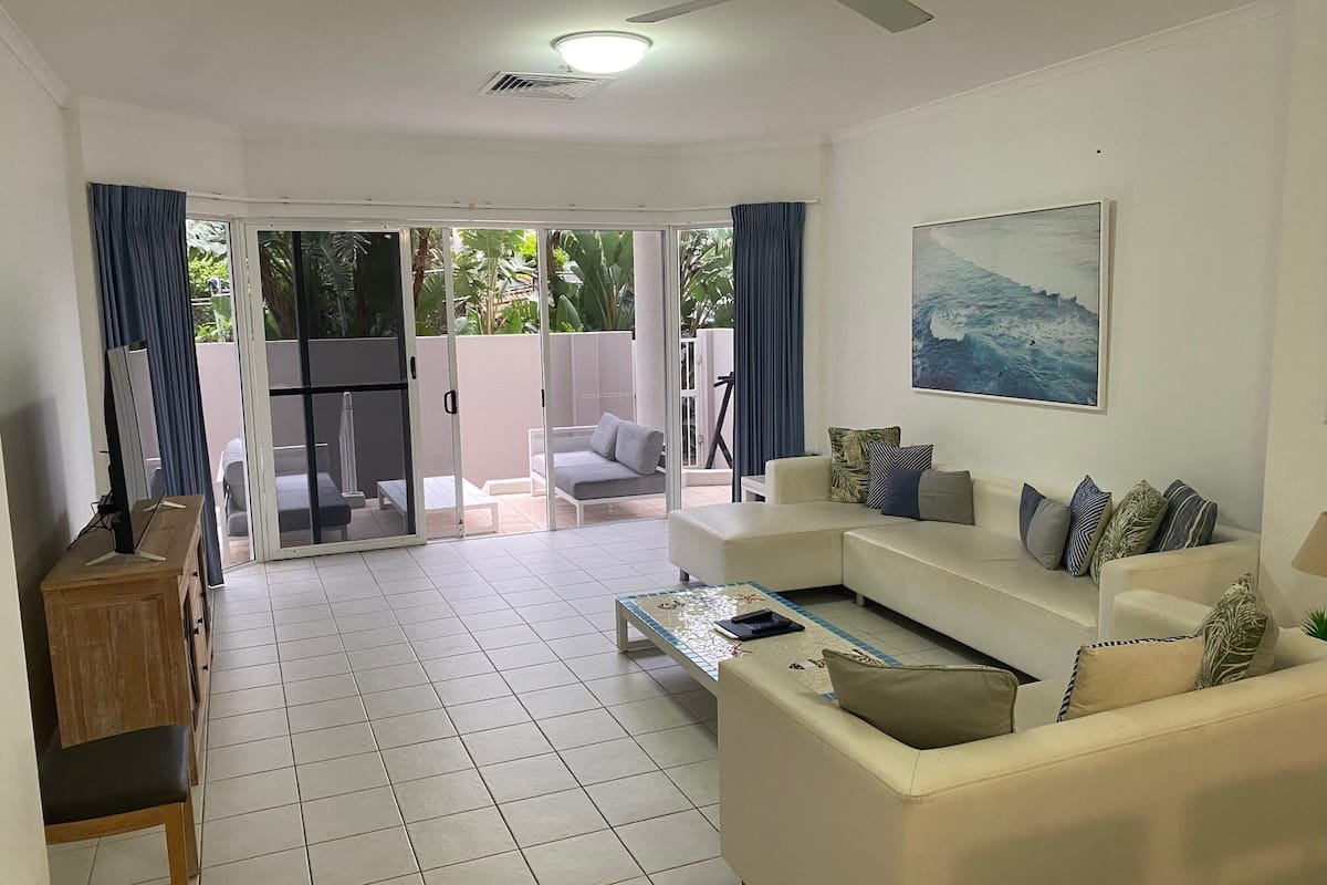 Two Bedroom Apartment - Ground Floor | Living area | 50-inch LED TV with cable channels, DVD player, foosball