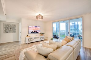 Two Bedroom Garden-West View Apartment | Living area | 50-inch LED TV with cable channels, DVD player, table football - Xanadu Main Beach Resort (Main Beach)