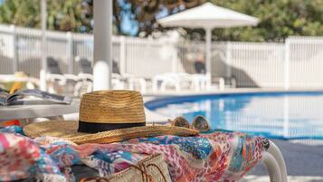 Indoor pool, outdoor pool, open 7:00 AM to 9:00 PM, sun loungers