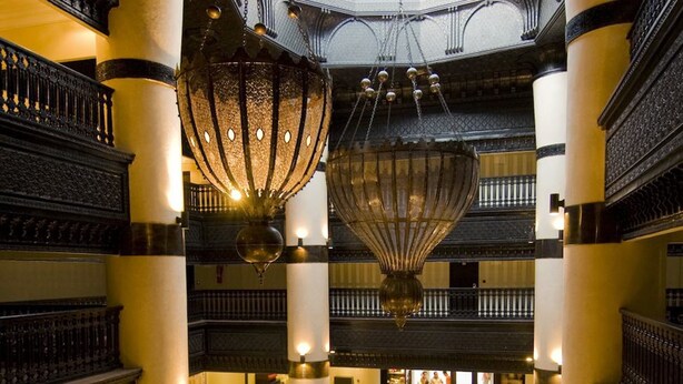 A spacious lobby with a central seating area, high ceilings, and ornate chandeliers. - Royal Decameron Tafoukt Beach Resort & Spa - All Inclusive (Agadir)