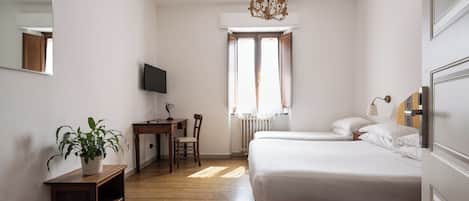 Standard Triple Room | In-room safe, desk, laptop workspace, blackout drapes