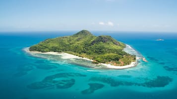 Private beach, white sand, sun loungers, beach umbrellas