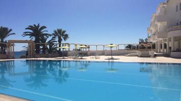 Indoor pool, outdoor pool, pool umbrellas, sun loungers