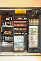 A vending machine area with various snacks, drinks, and bottled water.