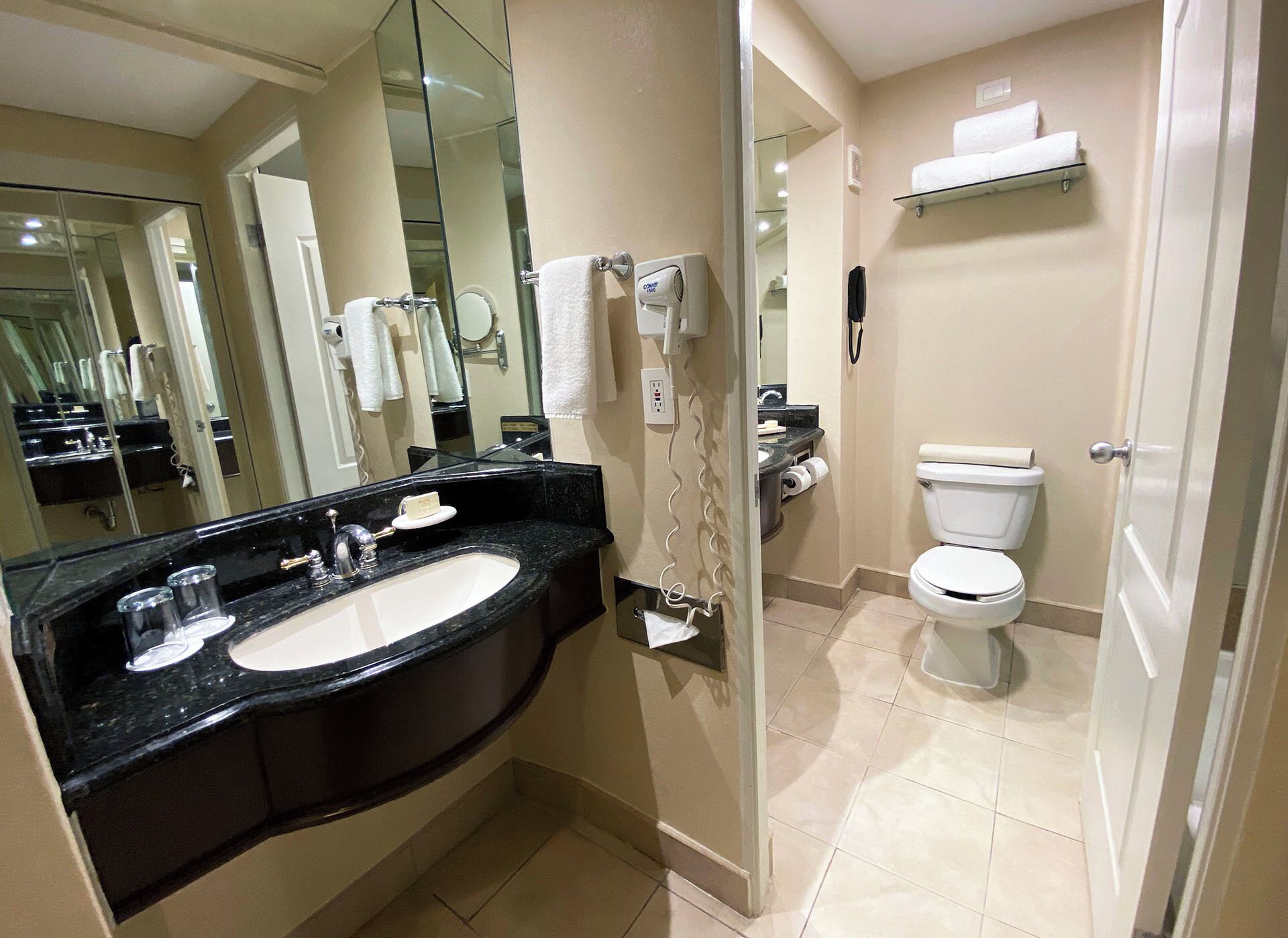 deluxe room, 1 king bed (expedia) | bathroom | free toiletries, hair dryer, towels