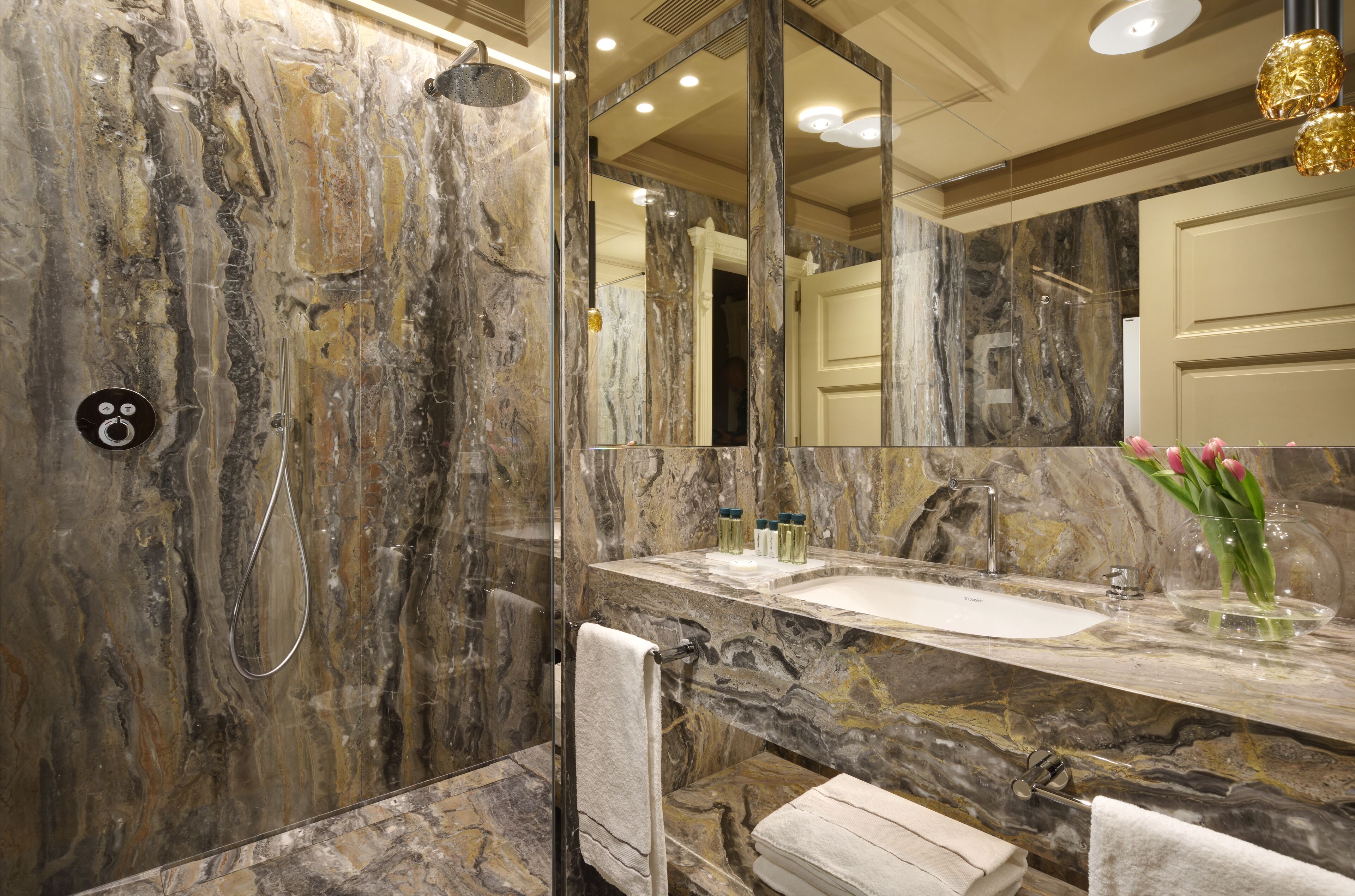 designer toiletries, hair dryer, bathrobes, slippers