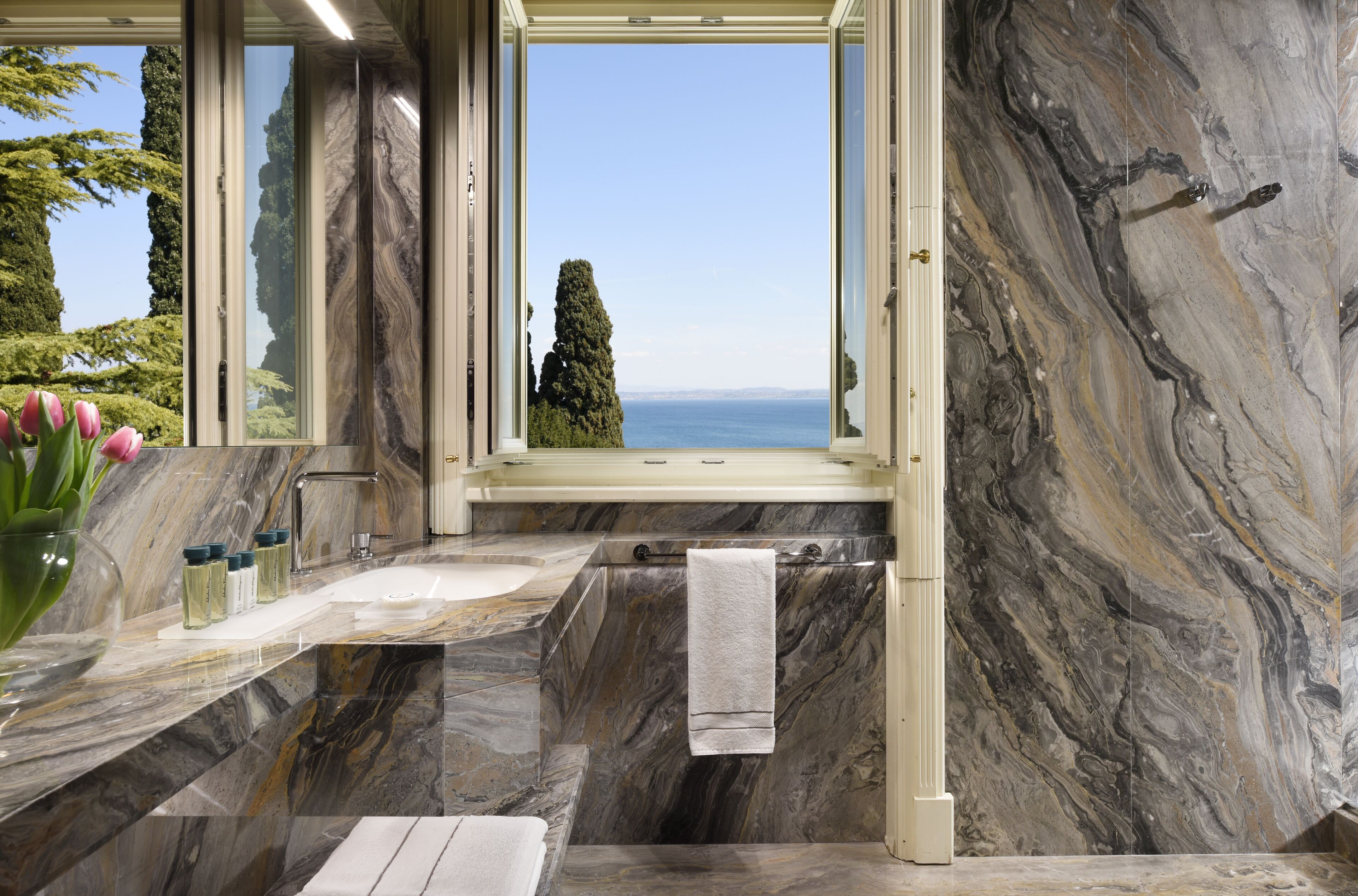 superior room, lake view | bathroom | designer toiletries, hair dryer, bathrobes, slippers