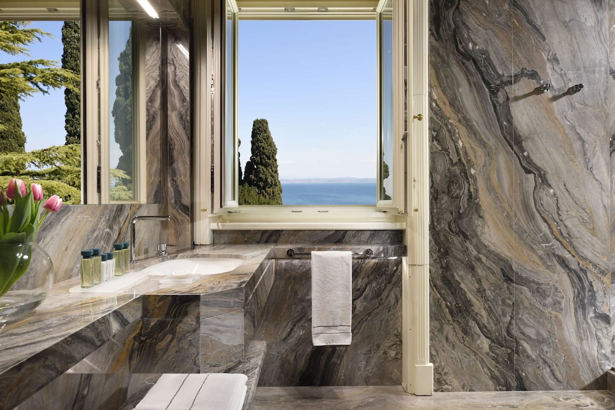 superior room, lake view | bathroom | designer toiletries, hair dryer, bathrobes, slippers