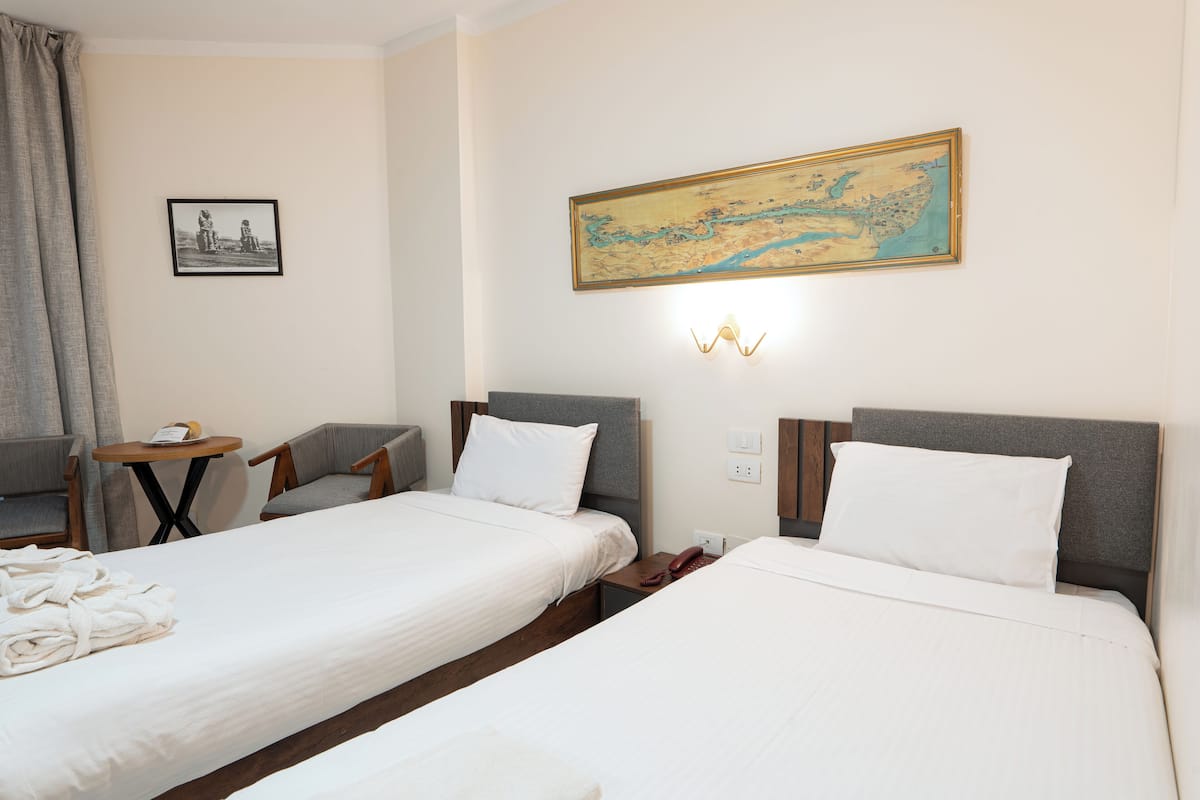 Double or Twin Room, Pool View | Blackout drapes, individually furnished, bed sheets
