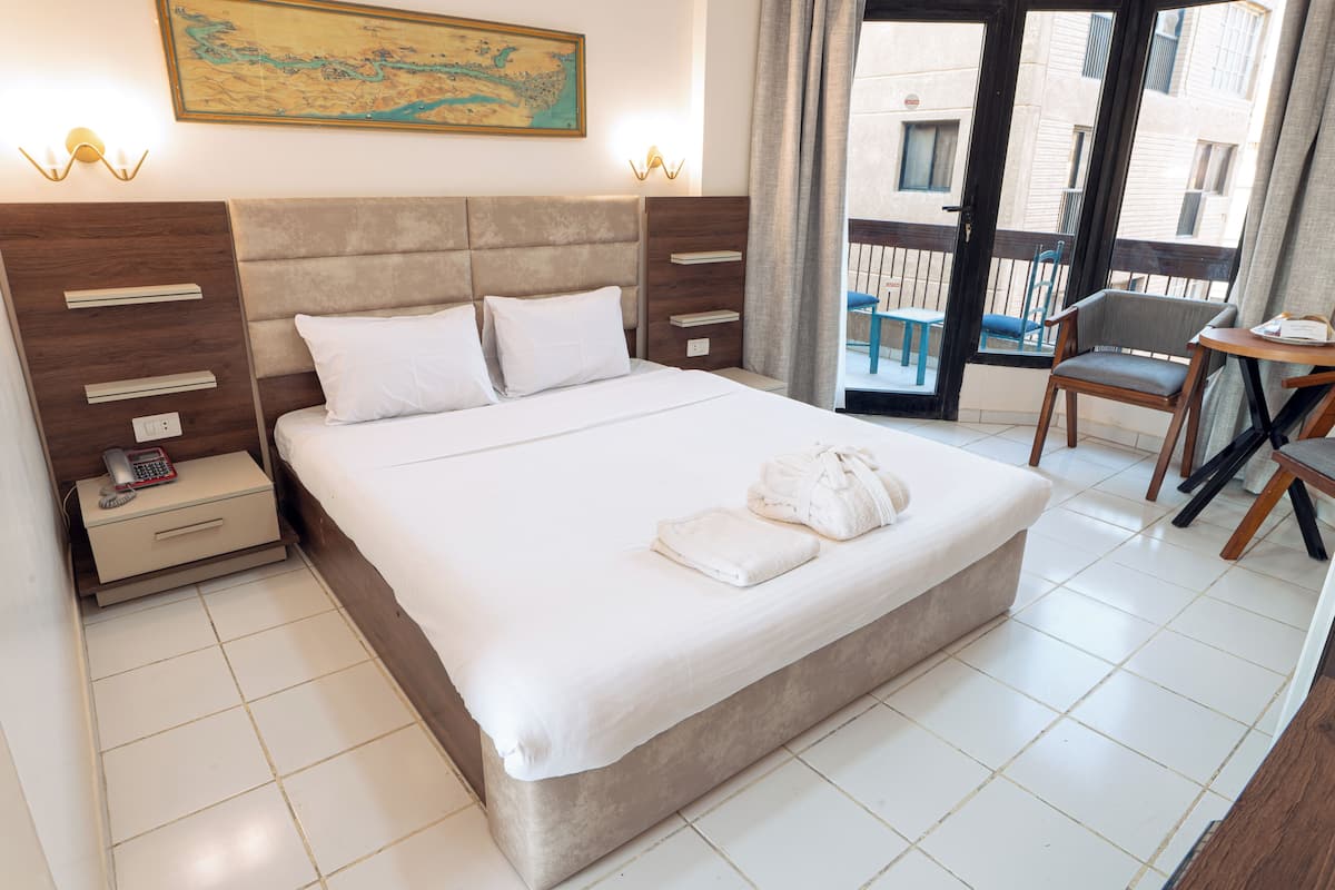 Double Room Single Use, Pool View | Blackout drapes, individually furnished, bed sheets