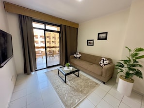 Suite ejecutiva, 1 cama Queen size y sofá cama | Cortinas blackout, cunas gratuitas, camas extra y ropa de cama